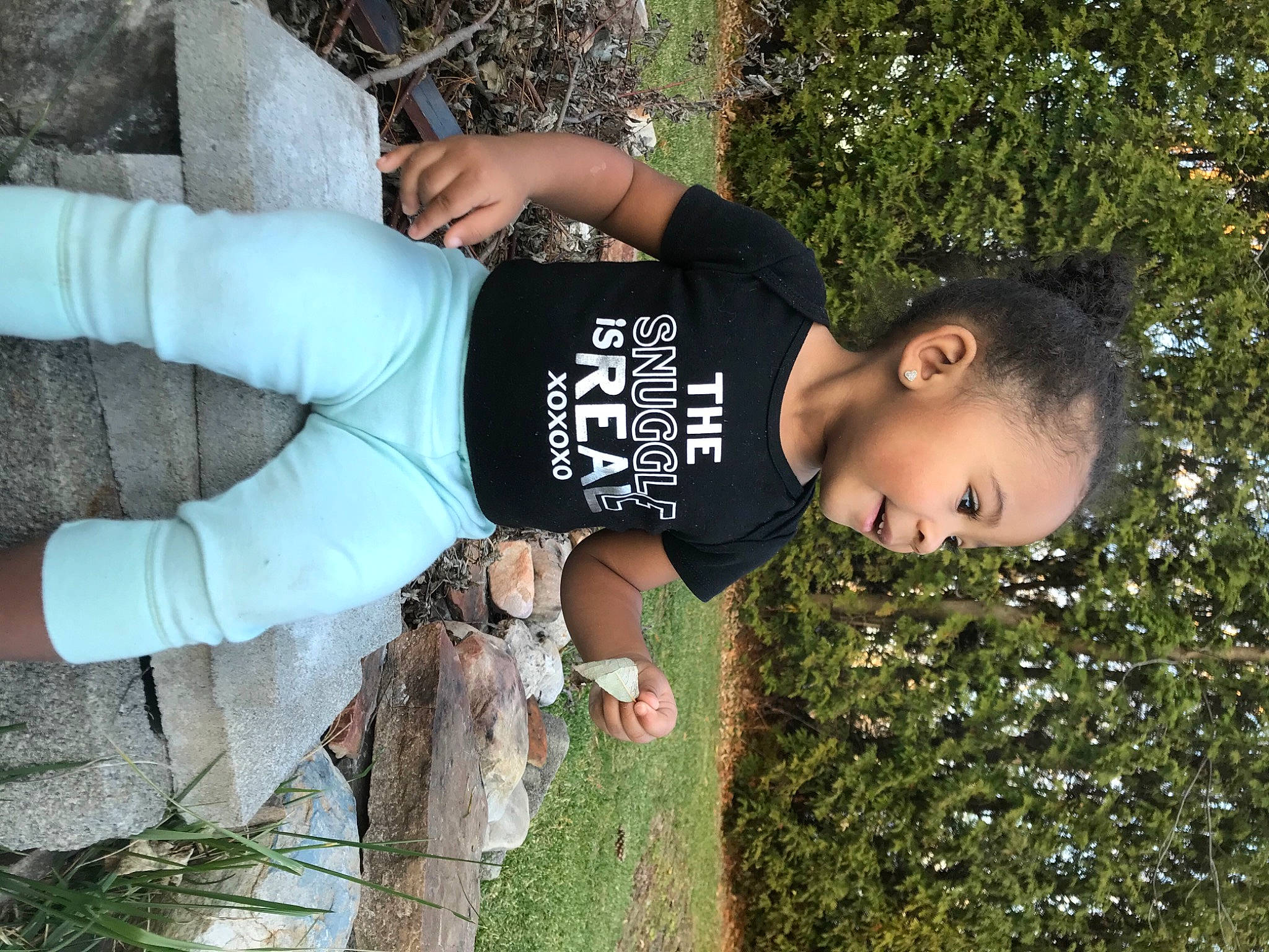 Willow Rose is registered to the contest to win money with this photo: black_hair, bracelet, cool, glove, happy, human, leaf, people_in_nature, person, spring, style, trunk, wrist