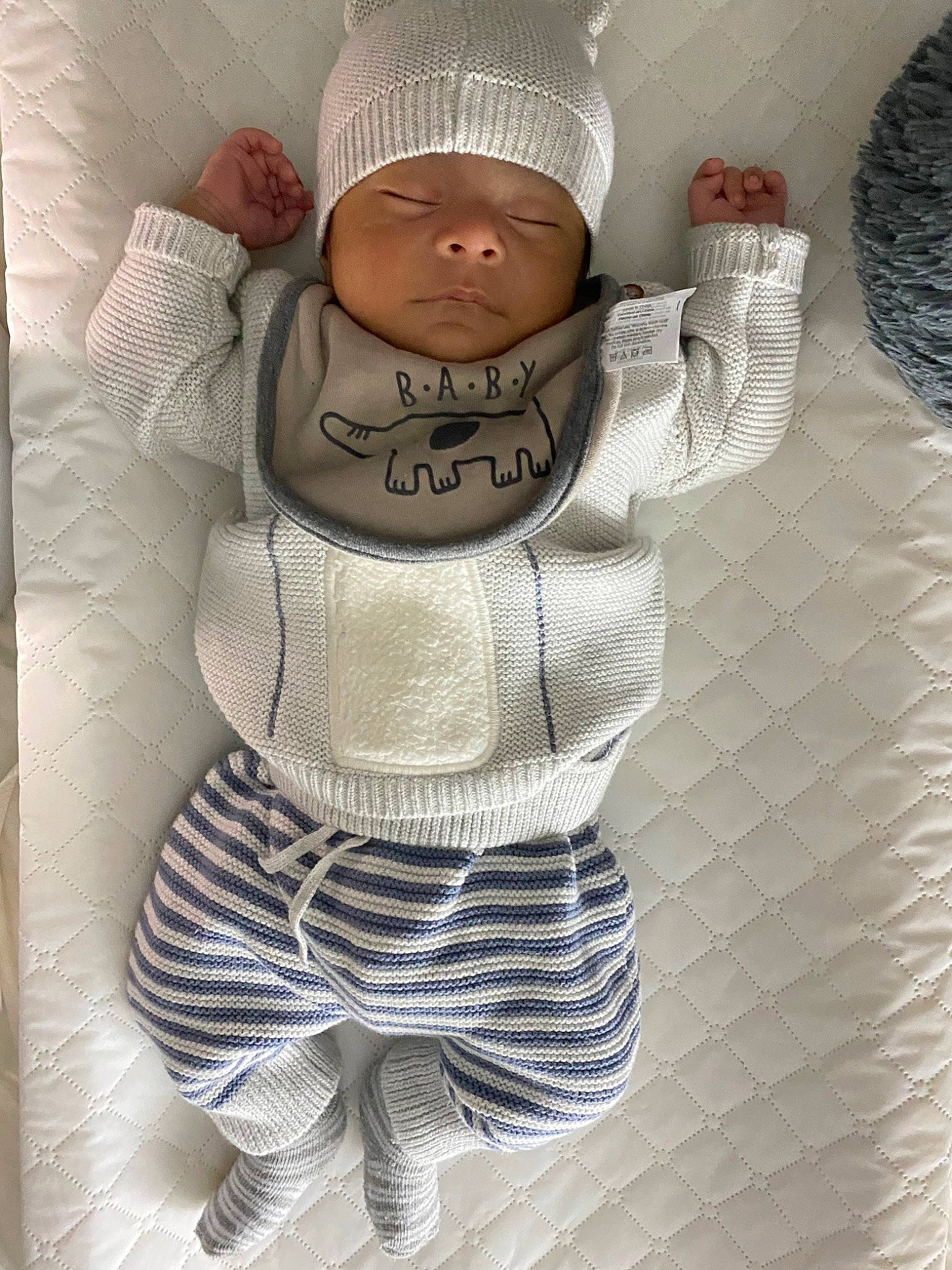Gerardo is registered to the contest to win money with this photo: baby, baby_products, baby_sleeping, baby_toddler_clothing, beanie, cap, child, fashion_accessory, headwear, helmet, hood, knit_cap, linens, pattern, person, personal_protective_equipment, sleeve, t_shirt, textile, toddler