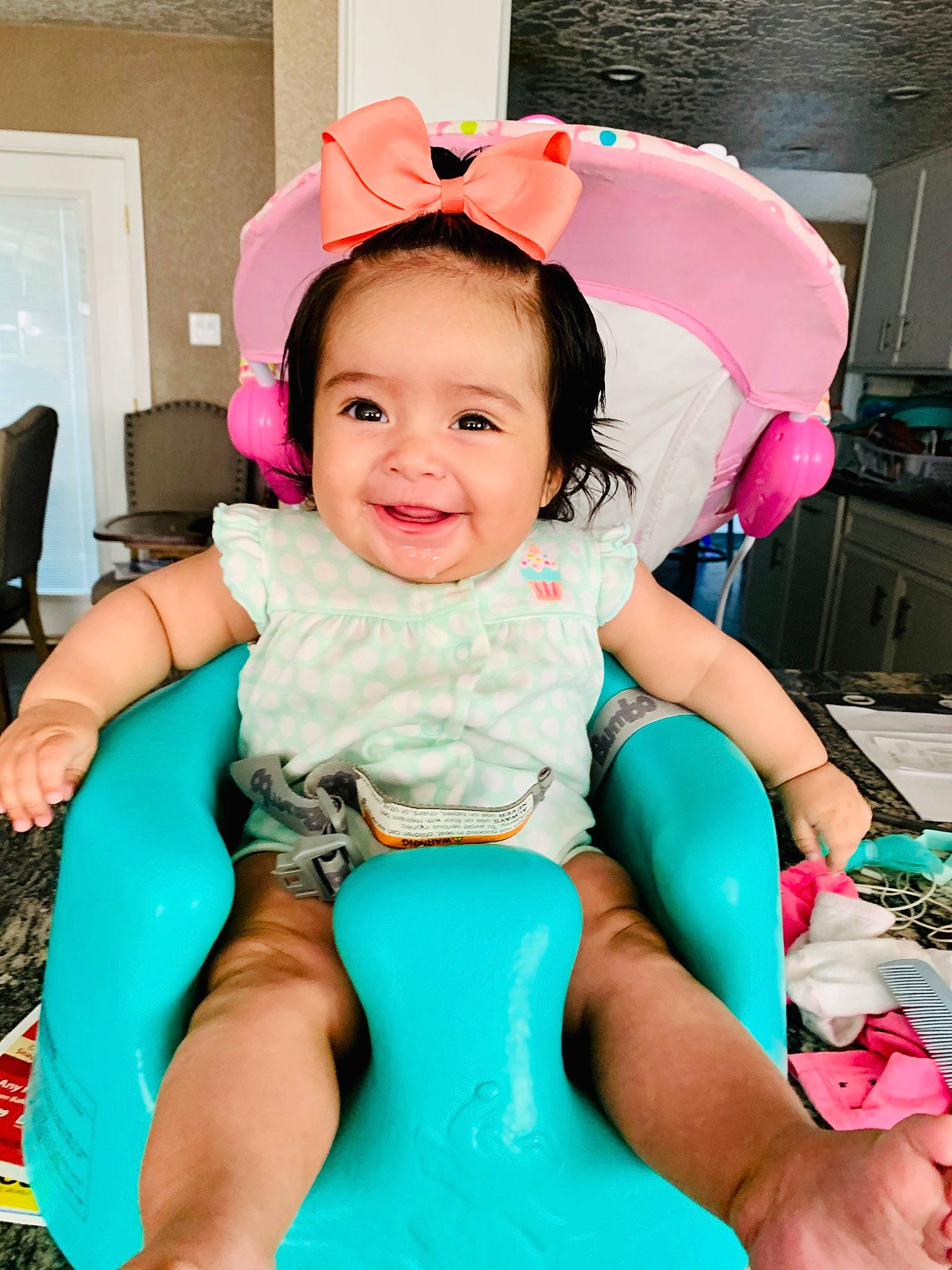 Lola is registered to the contest to win money with this photo: baby, baby_toddler_clothing, chair, child, face, facial_expression, fun, hairstyle, happy, head, human_body, joy, leisure, magenta, person, pink, purple, skin, smile, textile