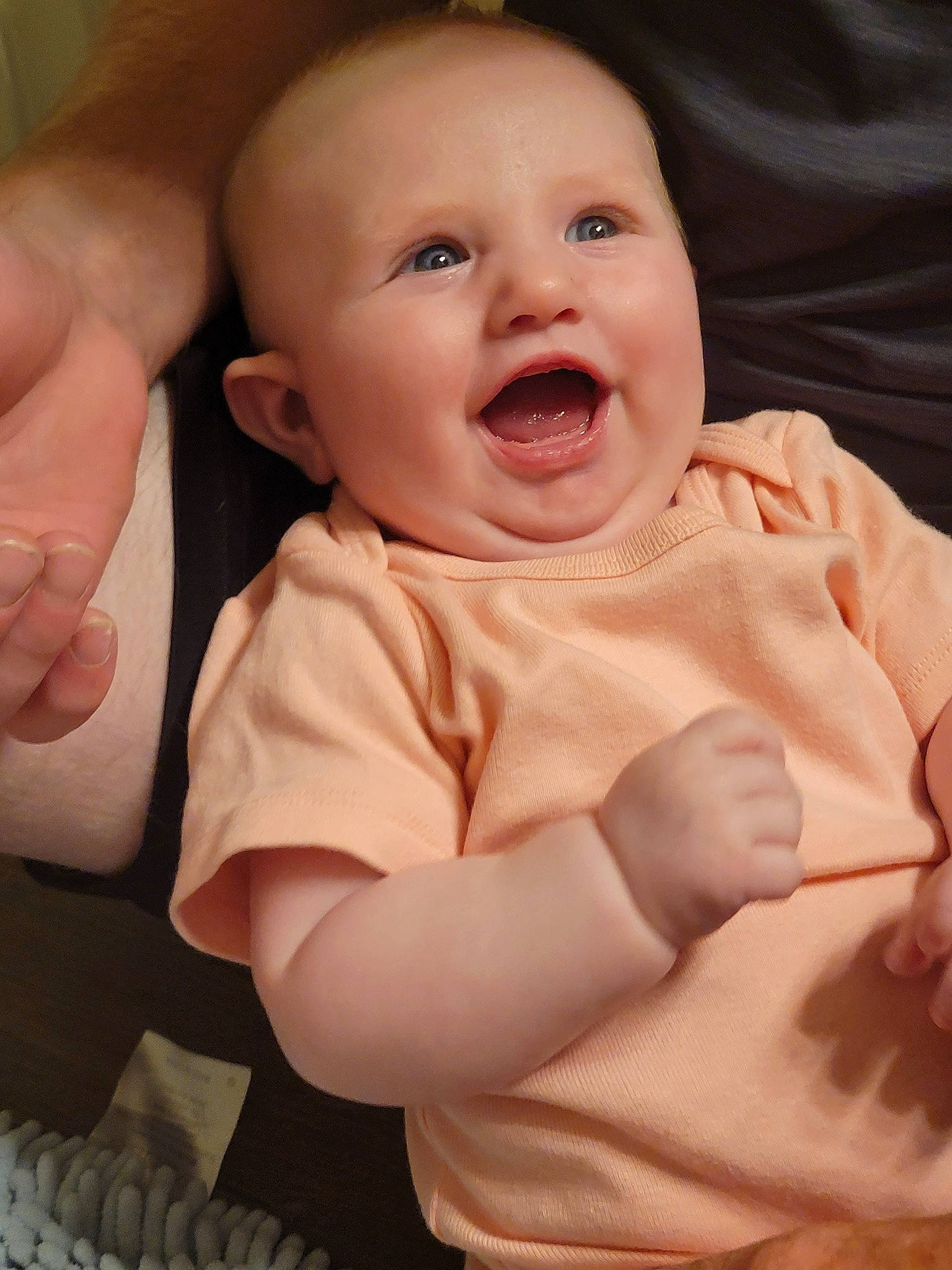 Emmie joined the competition — help win amazing prizes! arm, baby, baby_toddler_clothing, cheek, chin, comfort, eyebrow, facial_expression, finger, gesture, hand, happy, iris, lip, mouth, nose, person, skin, sleeve, smile