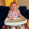 Araia is registered to the contest to win money with this photo: baby, blanket, child, colorful, couch, eyes, face, family, floral_clothing, hair, hands, happy, high_chair, home, indoor, infant, photography, portrait, sitting, smiling