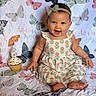 baby, child, girl, smiling, cupcake, birthday, candle, dress, headband, butterfly, pattern, blanket, sitting, celebration, happy, cute, portrait, infant, colorful, food