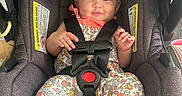 Araia joined the competition — help win amazing prizes! adorable, baby, baby_girl, bare_feet, car_interior, car_seat, child, floral_clothing, headband, indoors, infant, onesie, photography, portrait, safety_harness, safety_labels, sitting, smiling, vehicle, wide_eyed