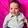 Timéo a rejoint le concours — aidez-le/la à gagner de superbes lots ! baby, child, smiling, face, white_shirt, blue_pants, pink_background, portrait, cute, happy, infant, sitting, clothing, person, young_child, casual, indoors, closeup, head_and_shoulders, joyful