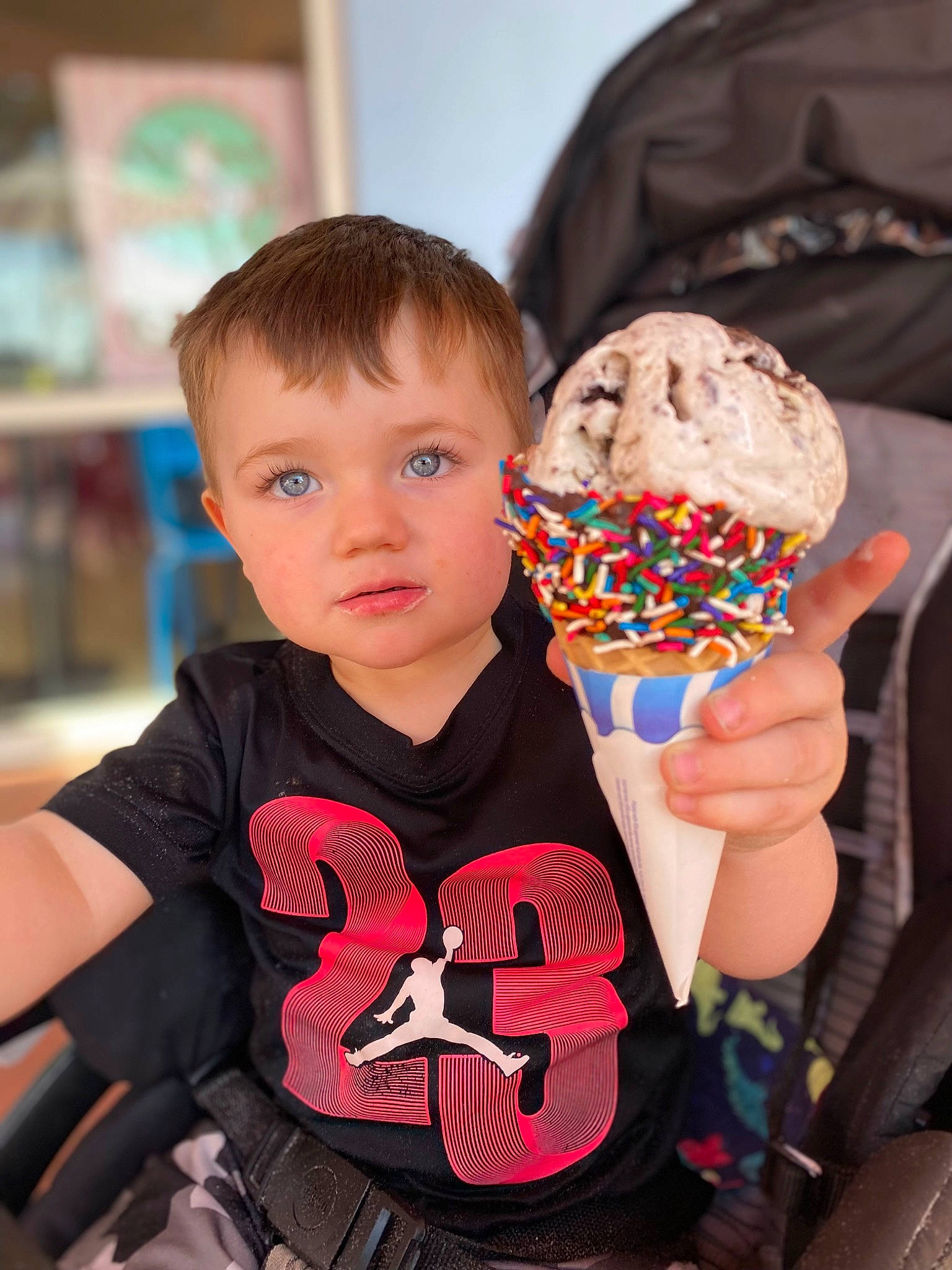 Brantley is registered to the contest to win money with this photo: baking, baking_cup, child, chocolate, cuisine, dairy, dessert, event, finger_food, food, frozen_dessert, fun, happy, ice_cream, ice_cream_cone, person, shelf, sorbetes, sweetness, t_shirt
