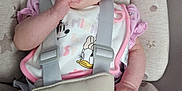 Athena-Rose is registered to the contest to win money with this photo: baby, bib, car_seat, child, clothing, comfort, cushion, cute, expression, eyes, face, hand, infant, pink, polka_dots, purple, seat, socks, stars, straps