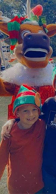 Lachlan is registered to the contest to win money with this photo: baseball_cap, cap, child, christmas_eve, cloud, cool, costume_hat, event, fashion_accessory, fun, happy, hat, headgear, headwear, holiday, joy, party_supply, person, selfie, smile