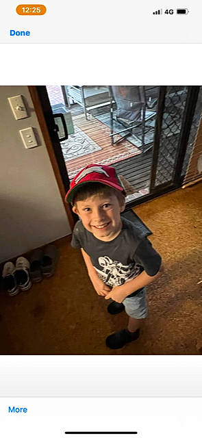 Lachlan joined the competition — help win amazing prizes! baseball_cap, cap, child, flooring, fun, happy, hat, joy, person, play, shorts, sitting, sleeve, smile, t_shirt, toddler