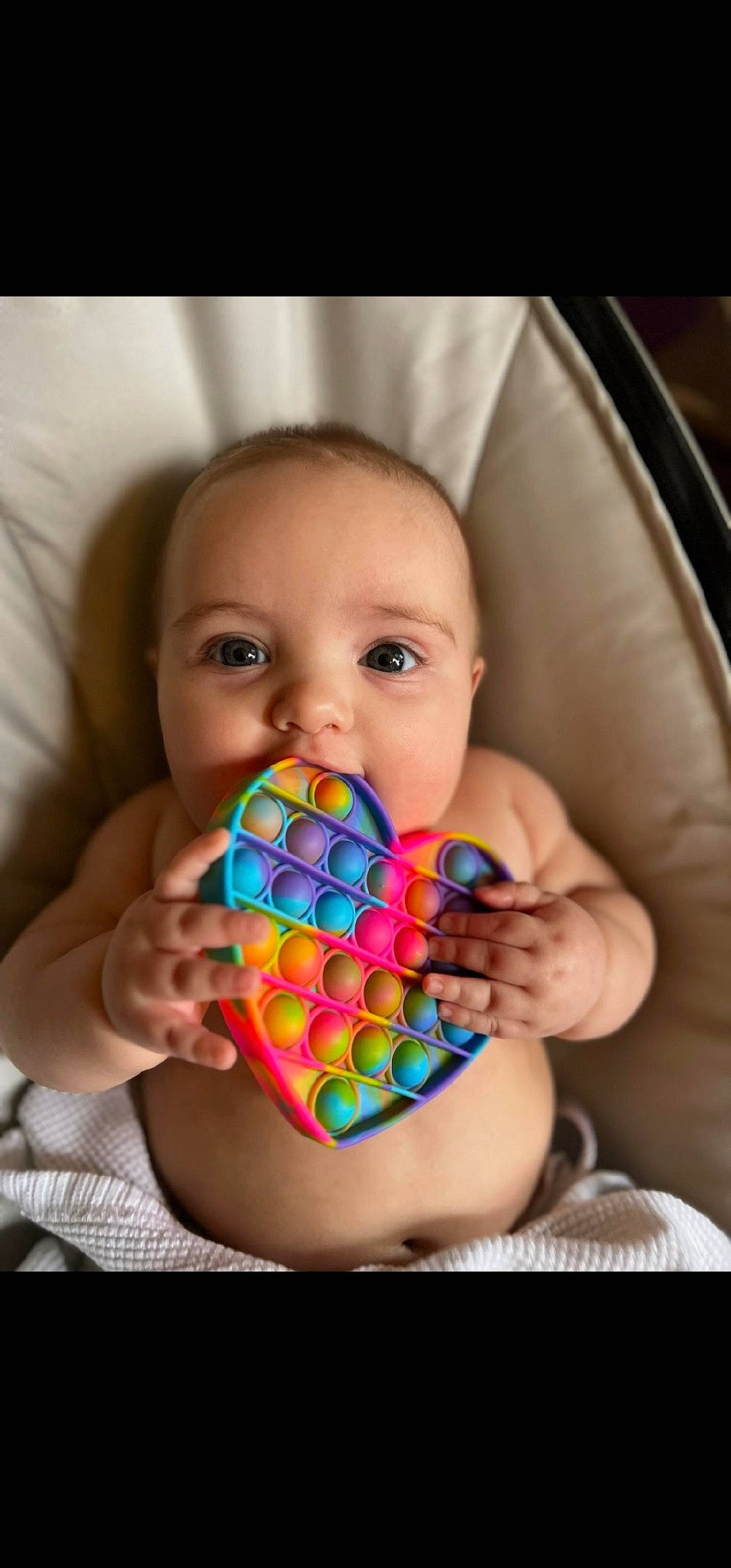 Lincoln is registered to the contest to win money with this photo: baby, baby_playing_with_toys, baby_products, child, comfort, finger, fun, happy, indoor_games_and_sports, mouth, nail, pattern, person, recreation, sitting, sweetness, table, thumb, toddler, toy