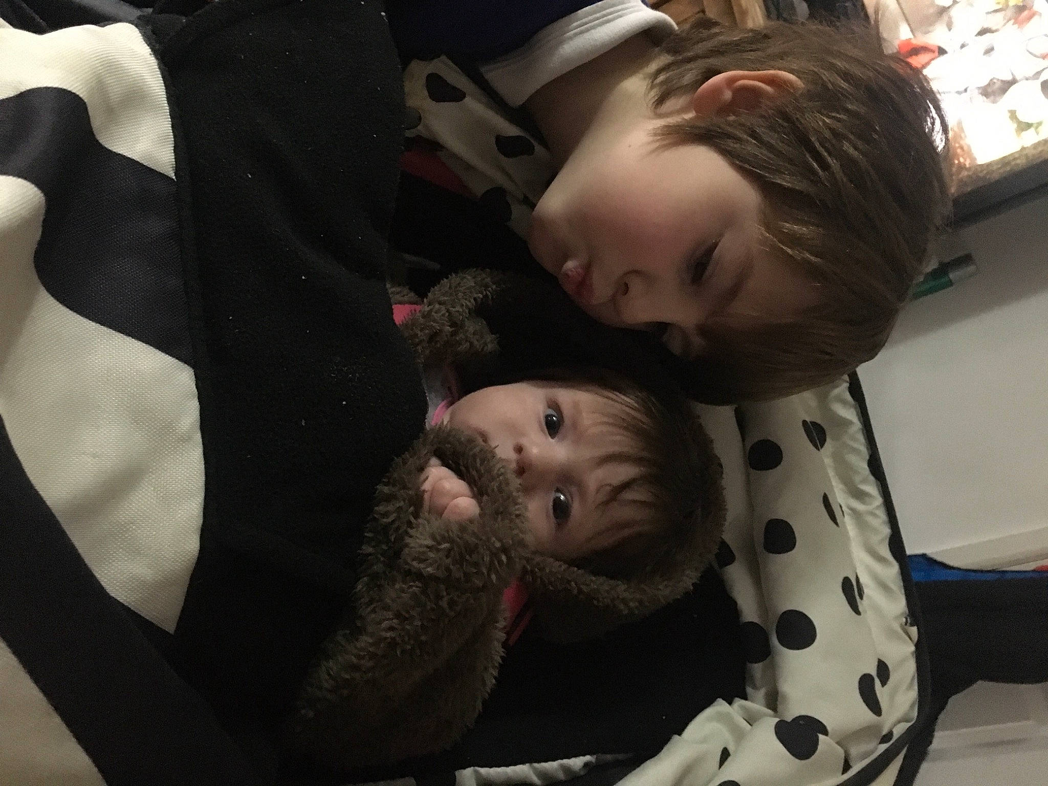 Logan is registered to the contest to win money with this photo: baby, baby_carriage, baby_products, car_seat, child, comfort, couch, fun, fur, gesture, happy, monochrome, nap, outerwear, pattern, person, room, sitting, sleep, toddler