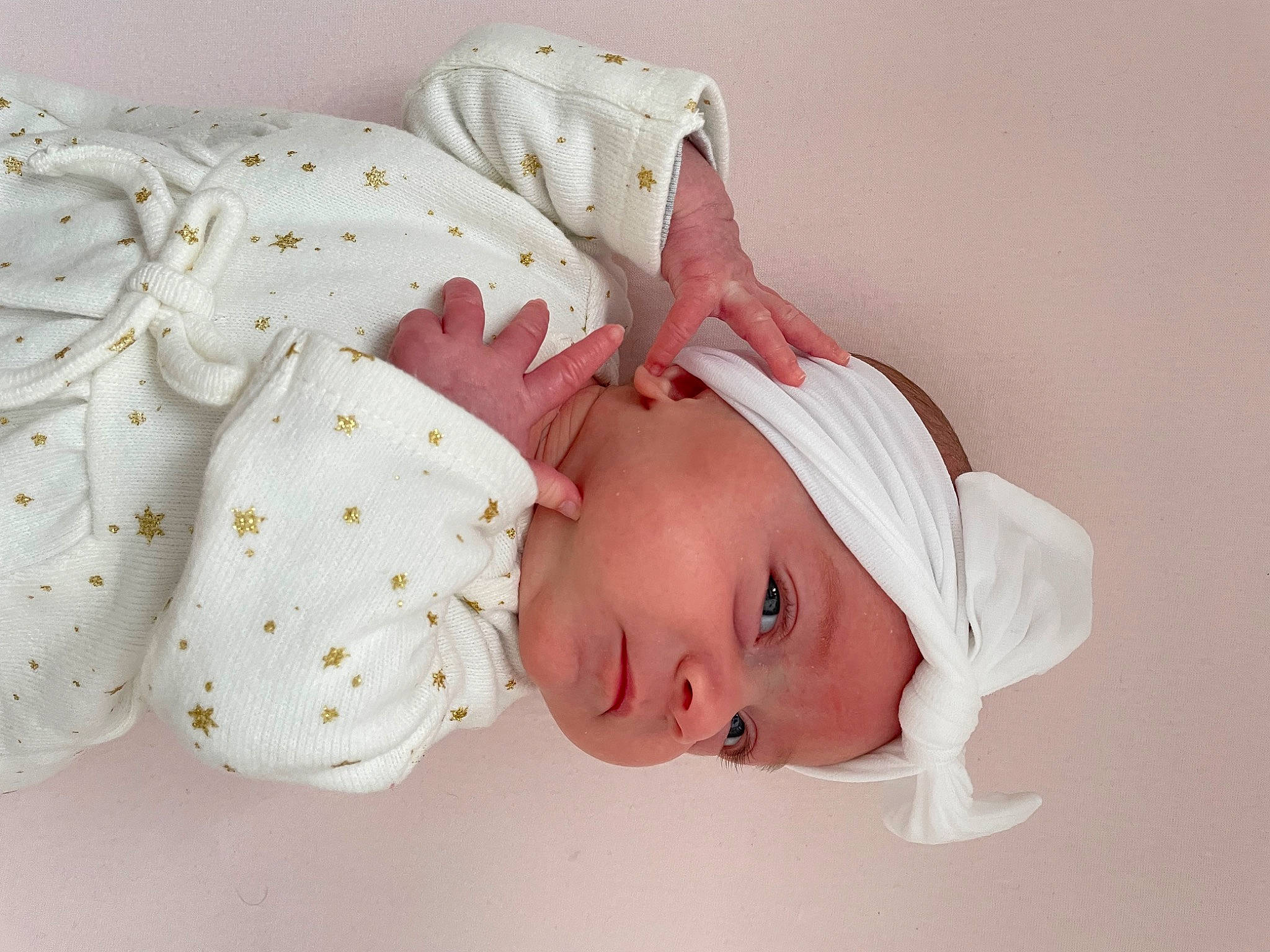 Ruby participe au concours pour gagner de l'argent avec cette photo : baby, baby_products, baby_sleeping, baby_toddler_clothing, beanie, cheek, child, comfort, fashion_accessory, hair_accessory, headwear, knit_cap, linens, pattern, peach, person, portrait_photography, sleeve, toddler