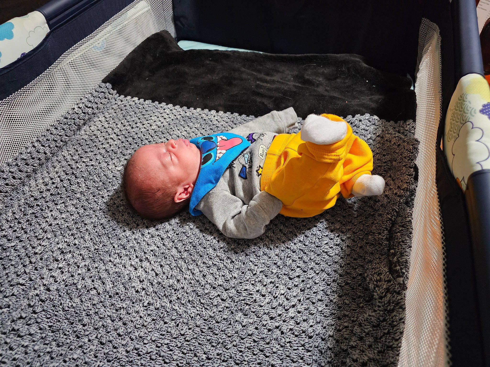 Antonio is registered to the contest to win money with this photo: asphalt, baby, baby_products, baby_toddler_clothing, child, comfort, crawling, flooring, fun, grass, linens, nap, person, road_surface, room, sidewalk, sitting, sleep, toddler, vacation