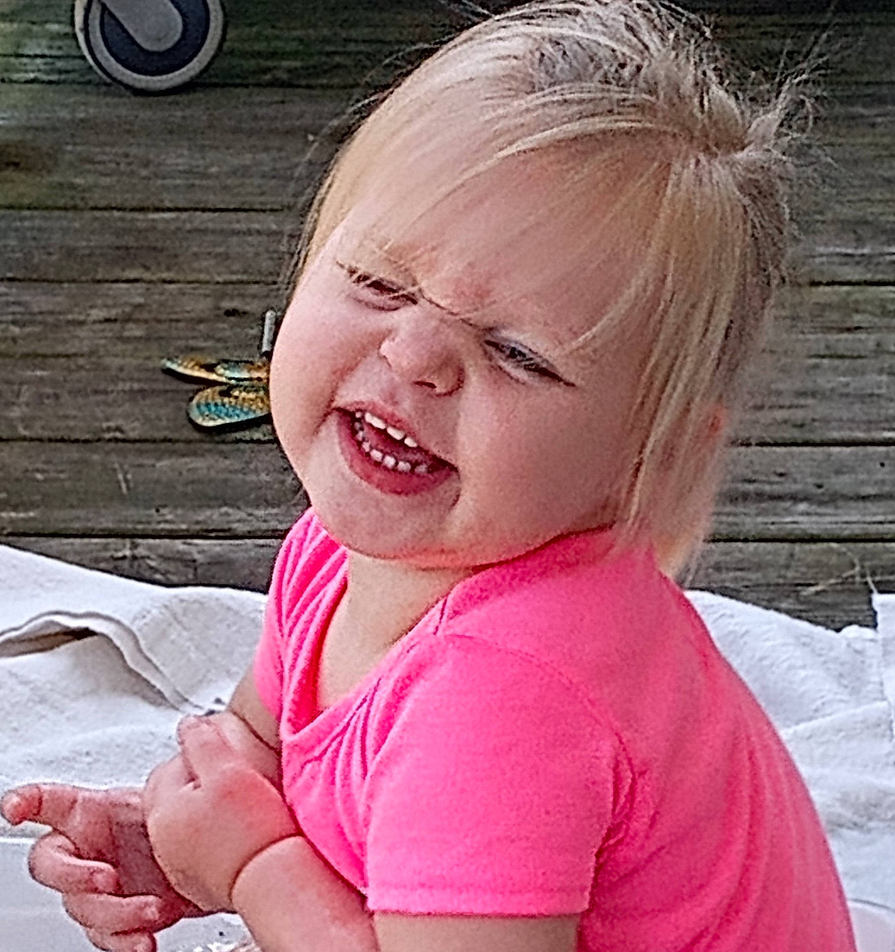 Ella joined the competition — help win amazing prizes! baby, baby_toddler_clothing, cheek, child, ear, eyelash, fashion_accessory, fun, gesture, grass, happy, jewellery, lip, mouth, nose, person, pink, sitting, skin, smile