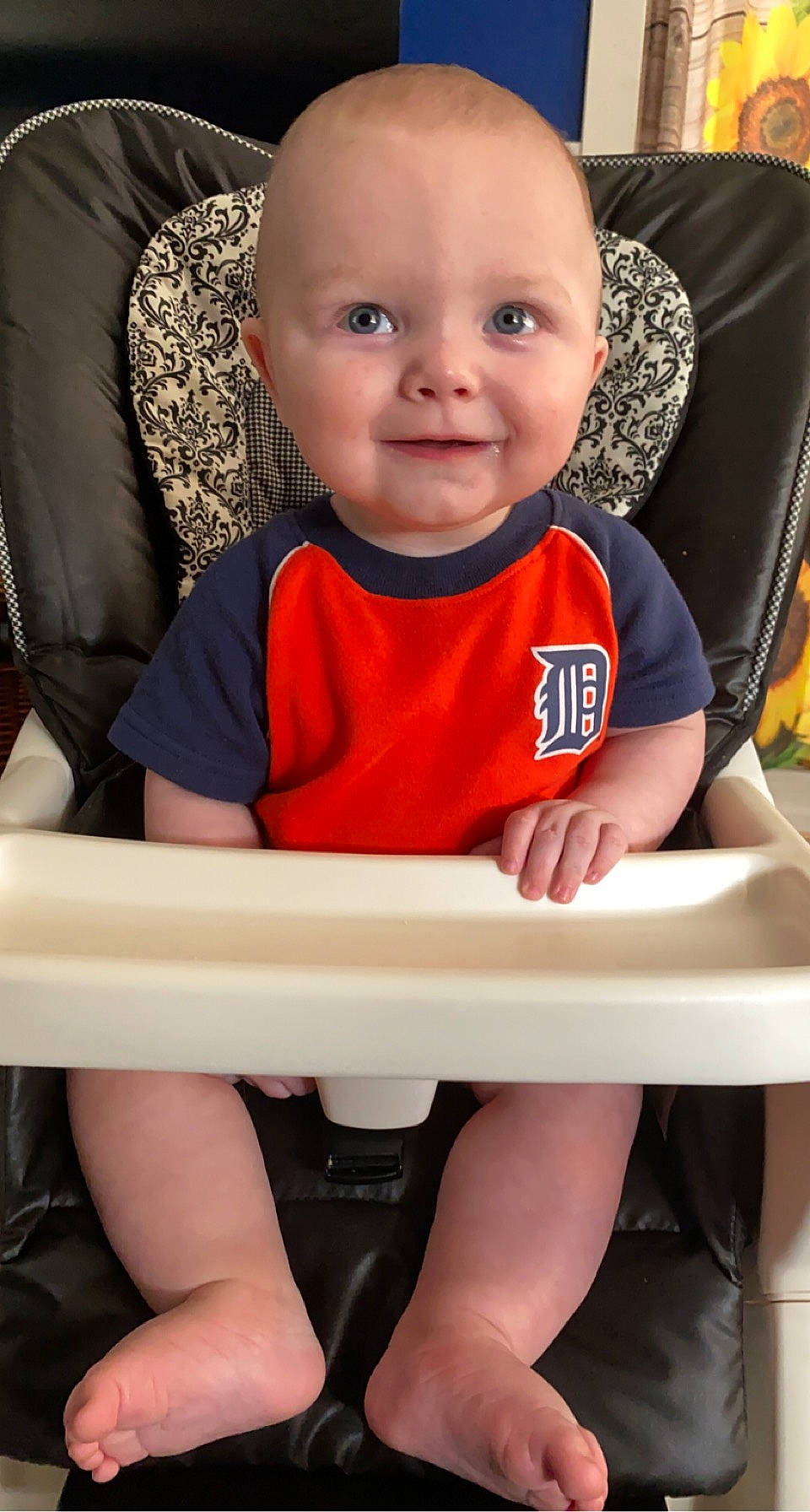 Greyson is registered to the contest to win money with this photo: baby, baby_toddler_clothing, black, cheek, chin, eye, face, facial_expression, hair, hairstyle, head, joy, mouth, organ, person, photograph, product, skin, sleeve, smile