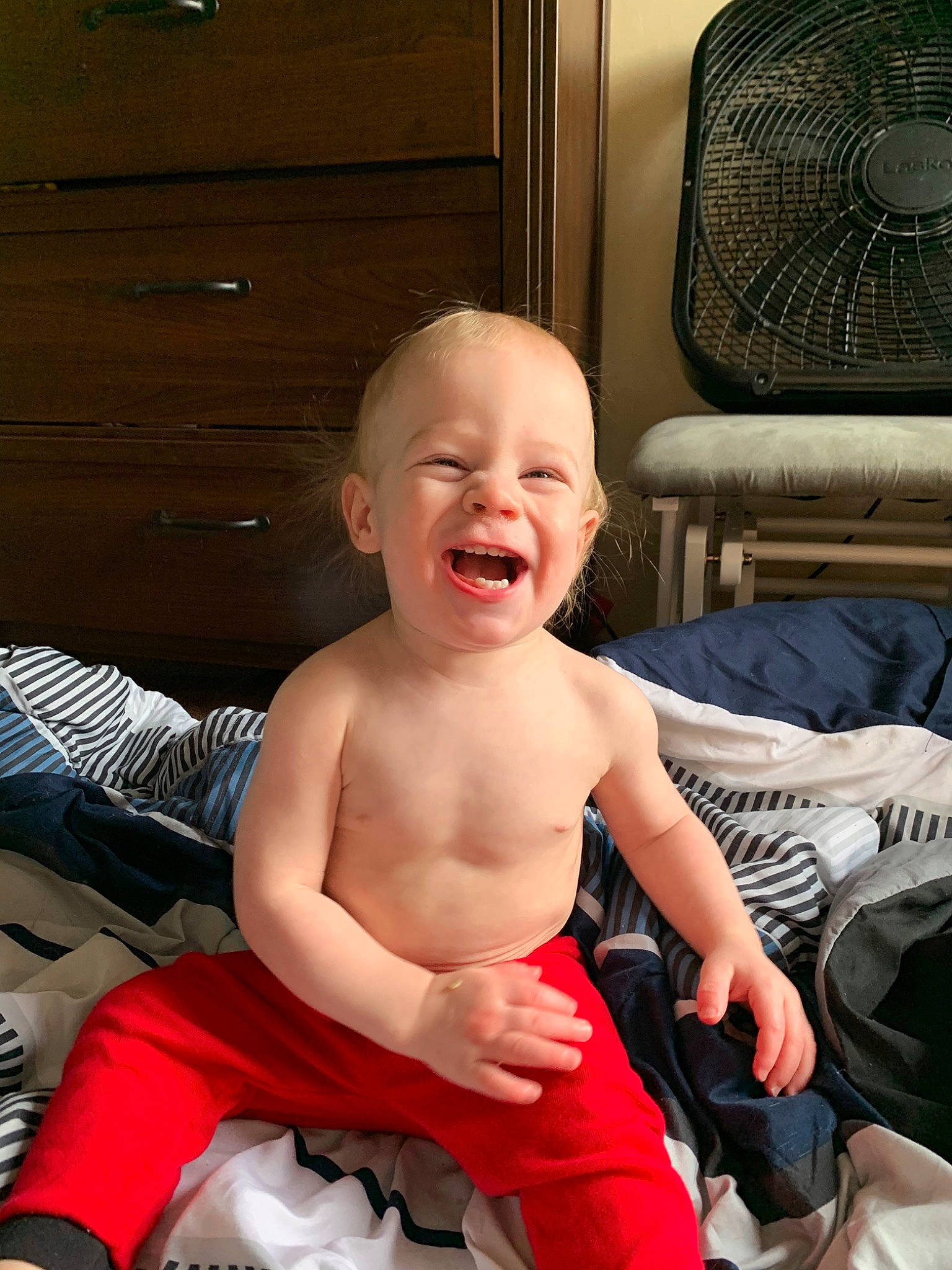 Bradley is registered to the contest to win money with this photo: baby, child, facial_expression, laugh, person, sitting, smile, toddler