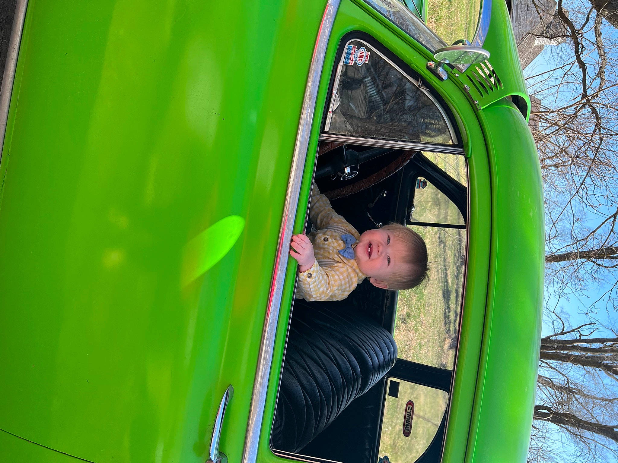 Blake is registered to the contest to win money with this photo: auto_part, automotive_exterior, automotive_tire, automotive_wheel_system, bumper, chute, fun, grass, leaf, leisure, motor_vehicle, outdoor_play_equipment, person, plant, playground_slide, public_space, recreation, tints_and_shades, toddler, tree