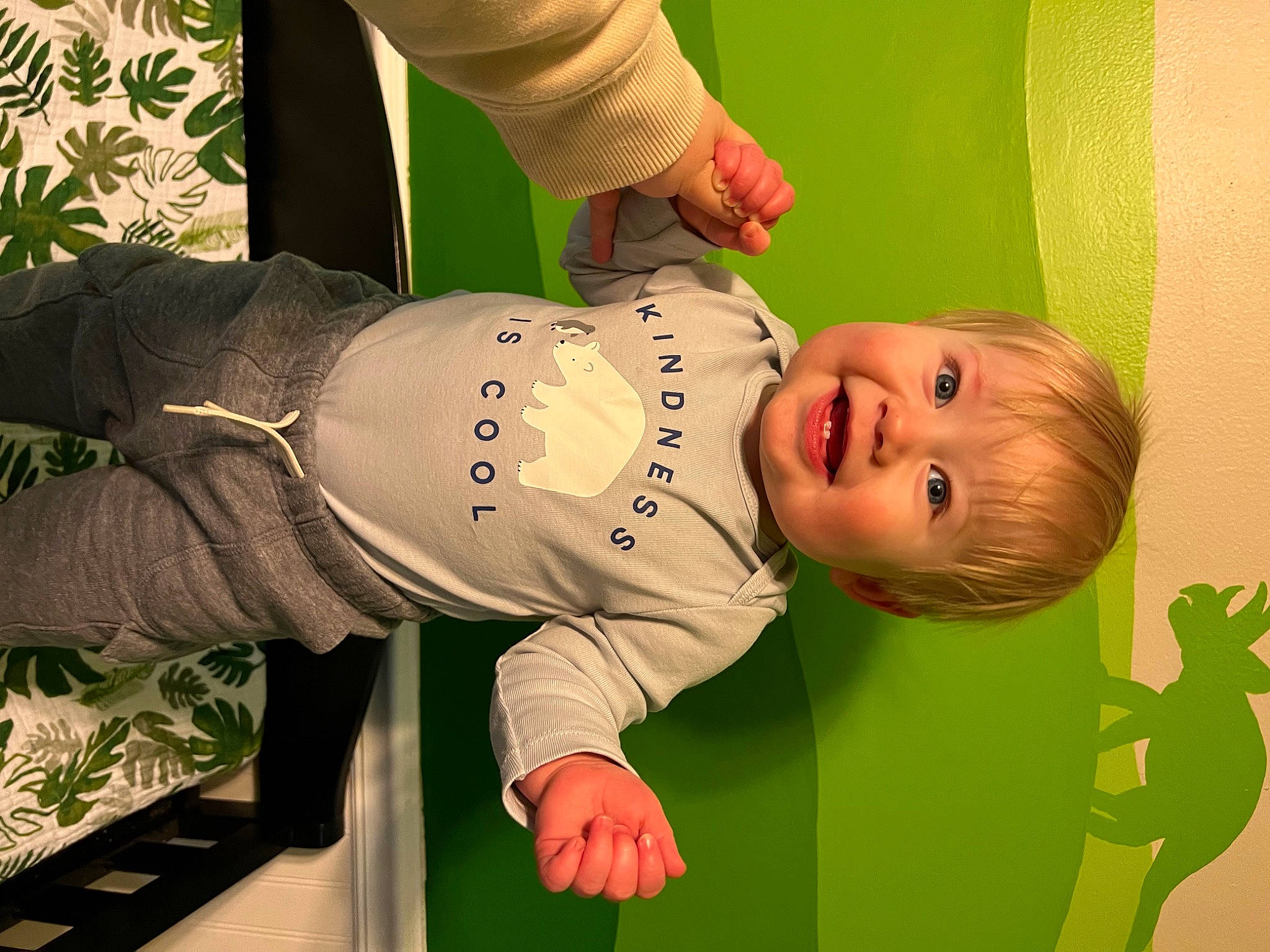 Blake is registered to the contest to win money with this photo: baby, baby_toddler_clothing, child, comfort, elbow, facial_expression, finger, fun, grass, happy, hat, joint, joy, knee, person, product, room, sitting, sleeve, smile