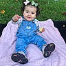 baby, toddler, child, outdoor, park, grass, blanket, pink_blanket, sitting, smiling, pointing, overalls, denim, bows, sneakers, portrait, face, tree, adults, autumn