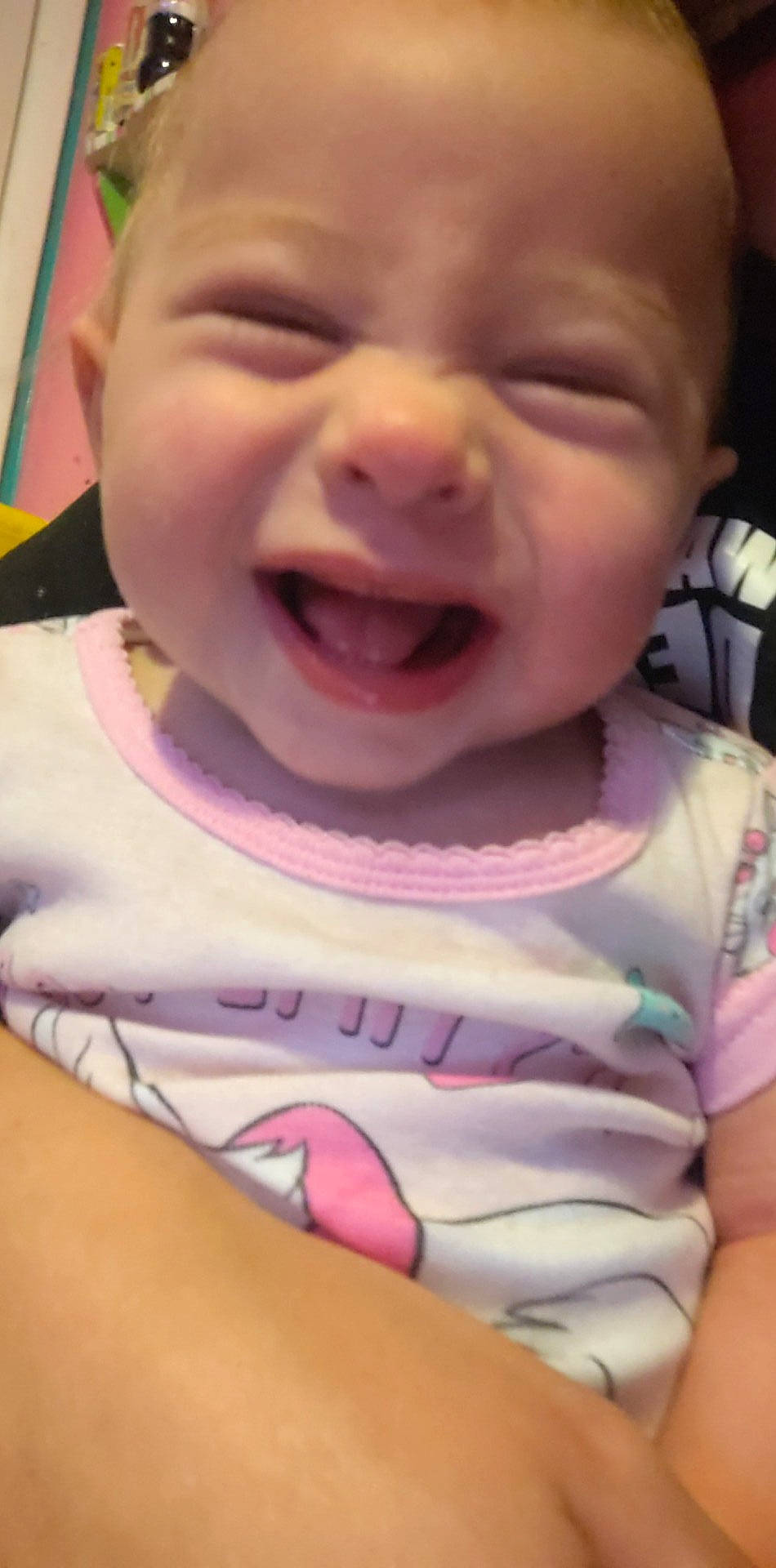 Dana is registered to the contest to win money with this photo: baby, baby_toddler_clothing, cheek, eye, eyebrow, facial_expression, happy, head, iris, jaw, lip, mouth, neck, nose, person, product, skin, sleeve, smile, tongue