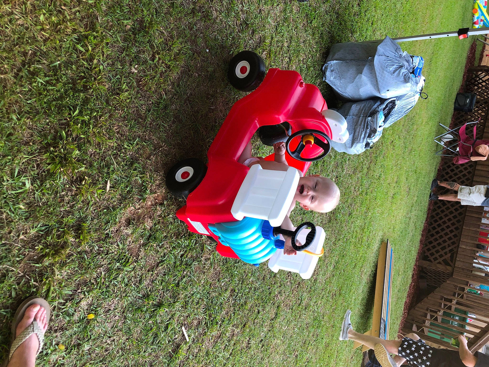 Dallas is registered to the contest to win money with this photo: adventure, carmine, foot, fun, grass, landscape, lawn, leisure, person, plant, recreation, soil, toddler, toy, walking_shoe, yard
