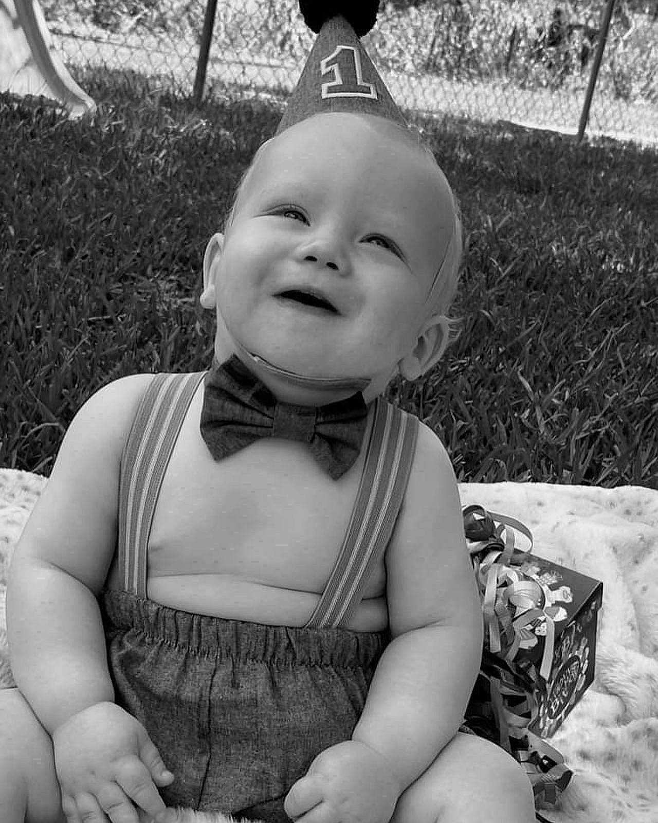 Dallas joined the competition — help win amazing prizes! baby, black, black_and_white, eye, face, gesture, grass, hairstyle, happy, head, headgear, human, iris, joy, monochrome, organ, person, photograph, plant, smile