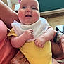 Solène Et Victorine participe au concours pour gagner de l'argent avec cette photo : arm, baby, bib, candid, closeup, face, hands, happy, holding, indoor, infant, person, plant, portrait, sitting, skin, smile, watch, window, yellow_clothing