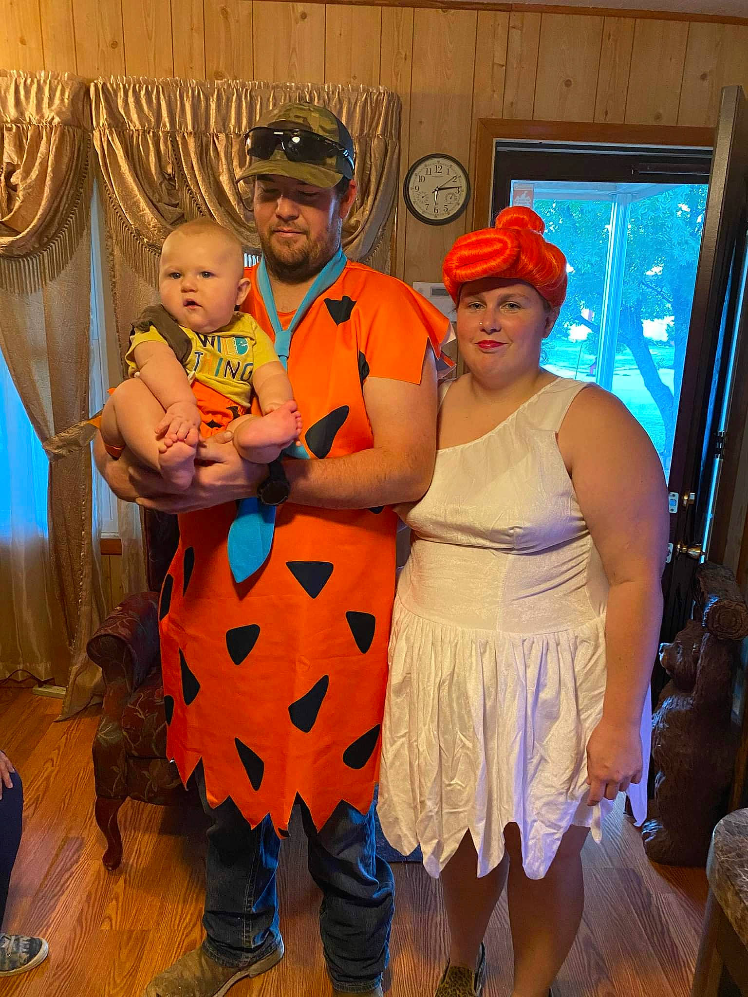 Liam Wayne is registered to the contest to win money with this photo: baby, baseball_cap, boot, chair, costume, curtain, event, flooring, fun, happy, hat, headwear, jewellery, joy, orange, party, person, room, sandal, smile