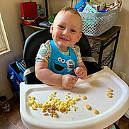 Charles is registered to the contest to win money with this photo: accessories, adult, baby, bag, bodypart, cooking, cutlery, face, finger, food, furniture, hand, handbag, head, male, man, mashingfood, person, photography, portrait