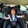 Elia-Maria participe au concours pour gagner de l'argent avec cette photo : toddler, child, car_seat, face_paint, car_interior, safety_harness, smiling, hair_bow, black_car_seat, seat_belt, rear_view_mirror, child_safety, happy, infant, casual_clothing, car_window, baby, portrait, kid, vehicle