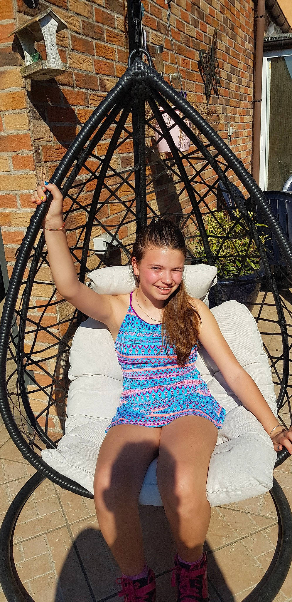 Brithany participe au concours pour gagner de l'argent avec cette photo : beauty, bicycle_tire, black_hair, fun, joy, lady, leg, leisure, long_hair, person, photo_shoot, photography, rim, spoke, thigh, wheel