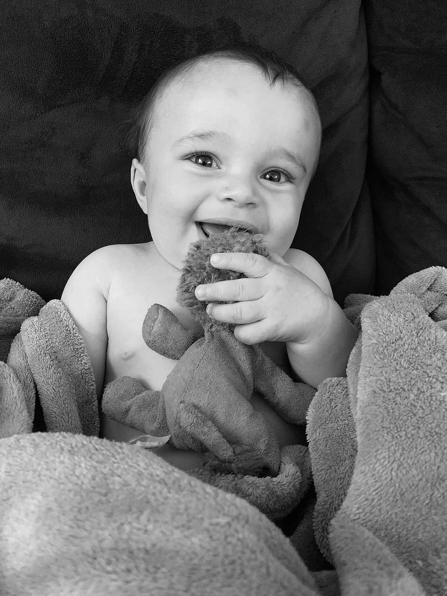 Barry is registered to the contest to win money with this photo: baby, black, black_and_white, cheek, child, eye, face, finger, hand, head, joy, lip, monochrome, monochrome_photography, nose, people, person, photograph, sitting, skin