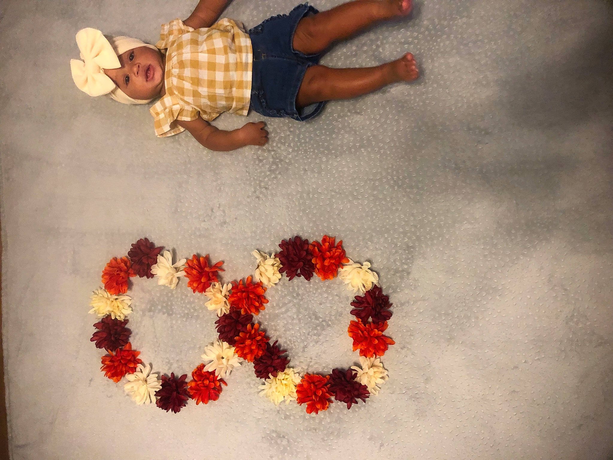 Raeleigh is registered to the contest to win money with this photo: art, artificial_flower, baby_toddler_clothing, carmine, craft, cut_flowers, event, fashion_accessory, flooring, floral_design, font, foot, headwear, heart, linens, pattern, person, petal, plant, textile