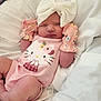 Alara joined the competition — help win amazing prizes! newborn, baby, infant, pink_onesie, hello_kitty, mittens, headband, bow, sleeping, bed, bedding, blanket, cute, resting, child, person, soft, floral, clothing, indoors