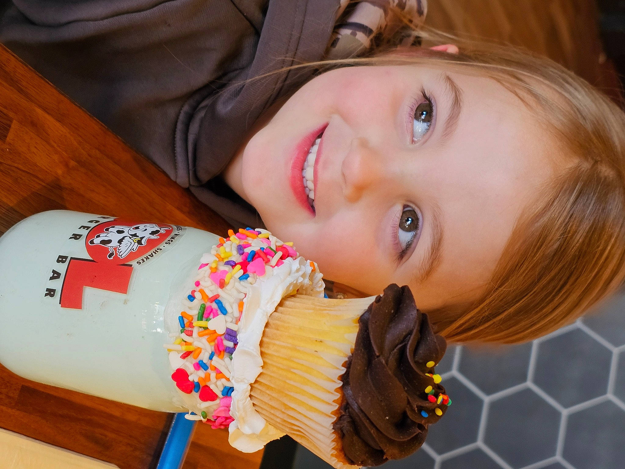 Abigail is registered to the contest to win money with this photo: brown_hair, child, dessert, drinkware, eyelash, face, fast_food, flash_photography, food, fun, happy, joy, junk_food, leisure, lip, nail, nose, person, portrait_photography, skin