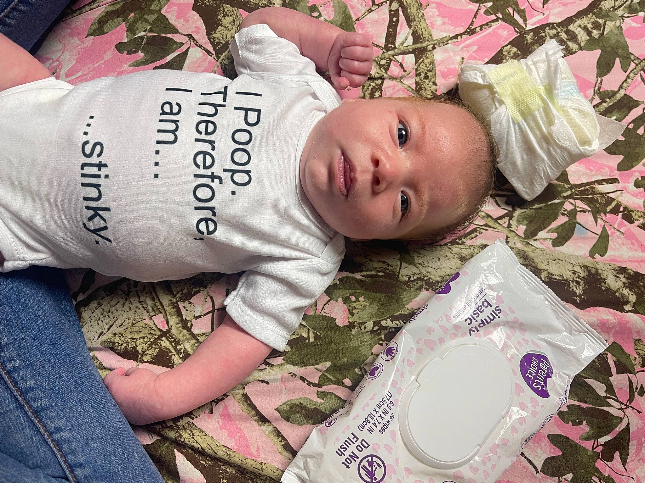 Ava-lynn is registered to the contest to win money with this photo: baby, baby_toddler_clothing, child, grass, happy, linens, magenta, pattern, person, plant, portrait_photography, sitting, skin, sleeve, t_shirt, toddler, tree, white, wood