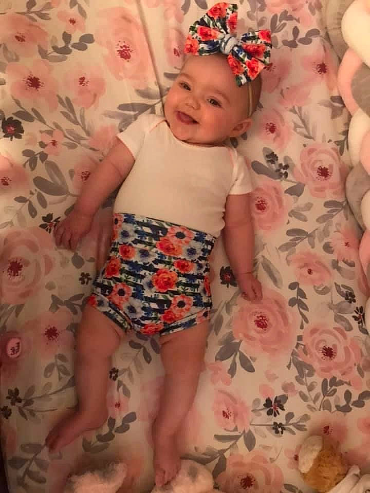 Cali May joined the competition — help win amazing prizes! arm, baby, baby_toddler_clothing, face, finger, hand, happy, headwear, human_leg, joy, leg, muscle, pattern, person, pink, plant, shorts, skin, sleeve, smile