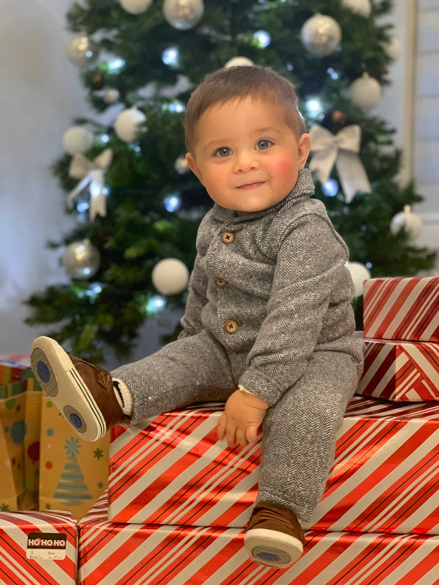 José joined the competition — help win amazing prizes! baby, baby_toddler_clothing, child, christmas, christmas_decoration, christmas_eve, christmas_ornament, christmas_tree, event, happy, holiday, holiday_ornament, joy, ornament, pattern, person, sitting, sleeve, smile, standing