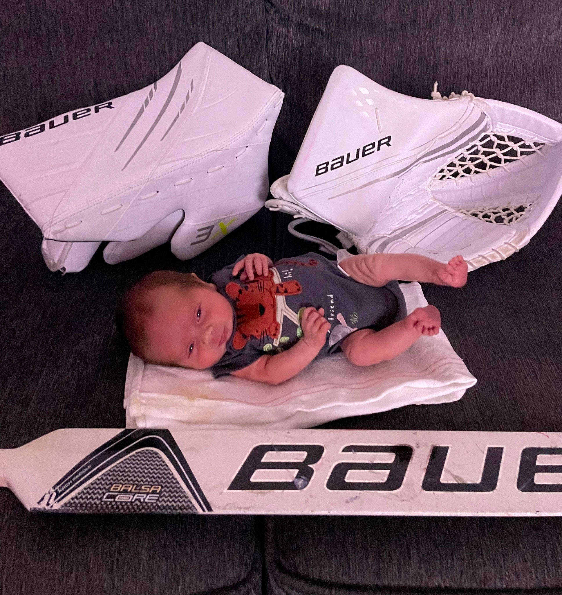 Leonidas is registered to the contest to win money with this photo: automotive_design, baby, baby_products, baby_sleeping, baby_toddler_clothing, bedtime, brand, carmine, child, comfort, font, linens, nap, person, product, room, sitting, sleep, sleeve, t_shirt