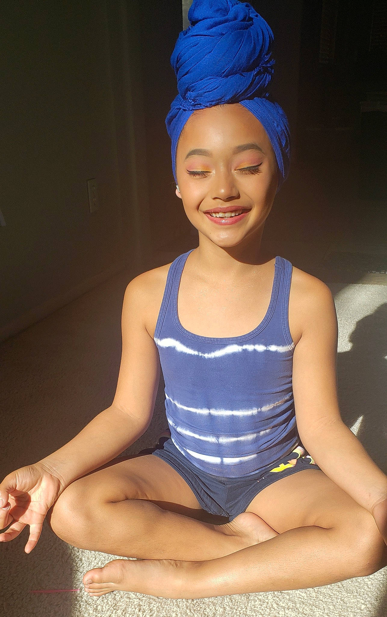 Kaleah joined the competition — help win amazing prizes! blue, clothing, electric_blue, headgear, joy, leg, performance, person, photography, sitting, smile, sportswear, swim_cap