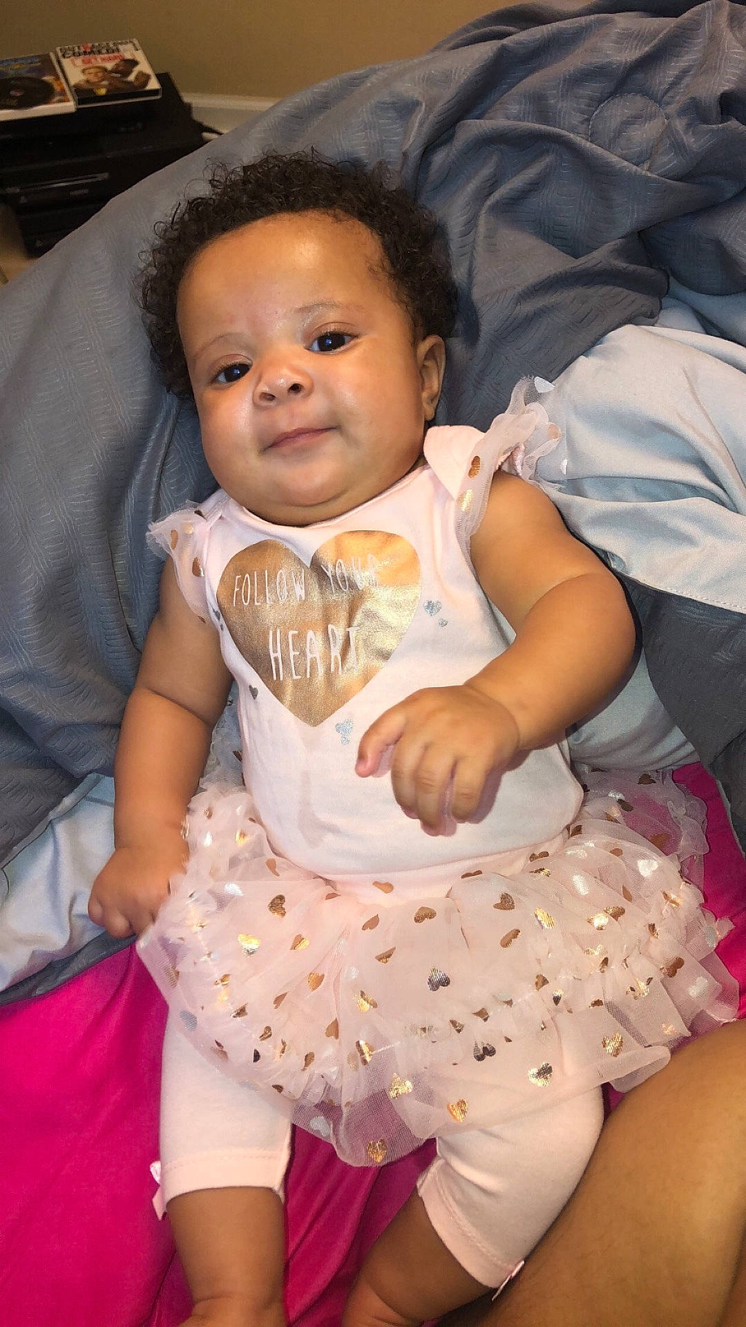 Westlynn is registered to the contest to win money with this photo: abdomen, child, day, fun, girl, infant, iris, leg, person, pink, product, sitting, skin, smile, textile, toddler, trunk