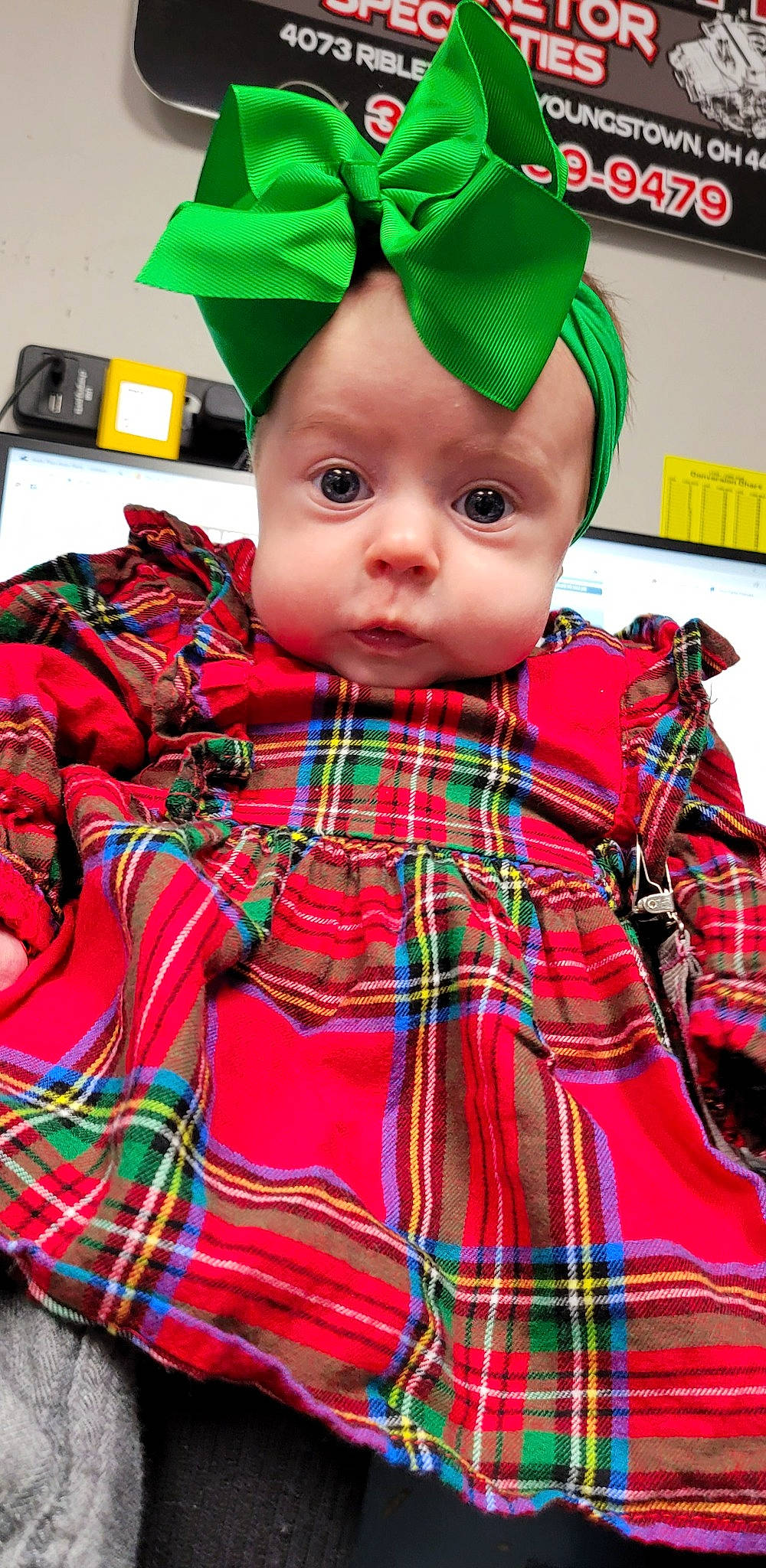 Samara joined the competition — help win amazing prizes! baby_toddler_clothing, cap, child, clothing, collar, costume_hat, doll, fashion, fashion_design, green, hat, outerwear, pattern, person, plaid, red, sleeve, tartan, textile, toddler