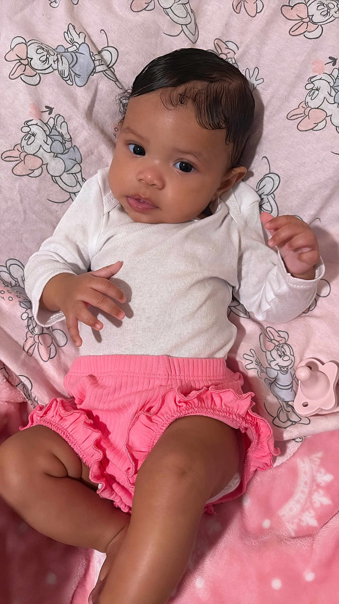 Sayari joined the competition — help win amazing prizes! baby, infant, blanket, pink, white_clothing, pacifier, minnie_mouse, cartoon_pattern, frilly_shorts, cute, lying_down, indoors, soft_texture, child, portrait, baby_girl, sleepwear, toddler, hand, face