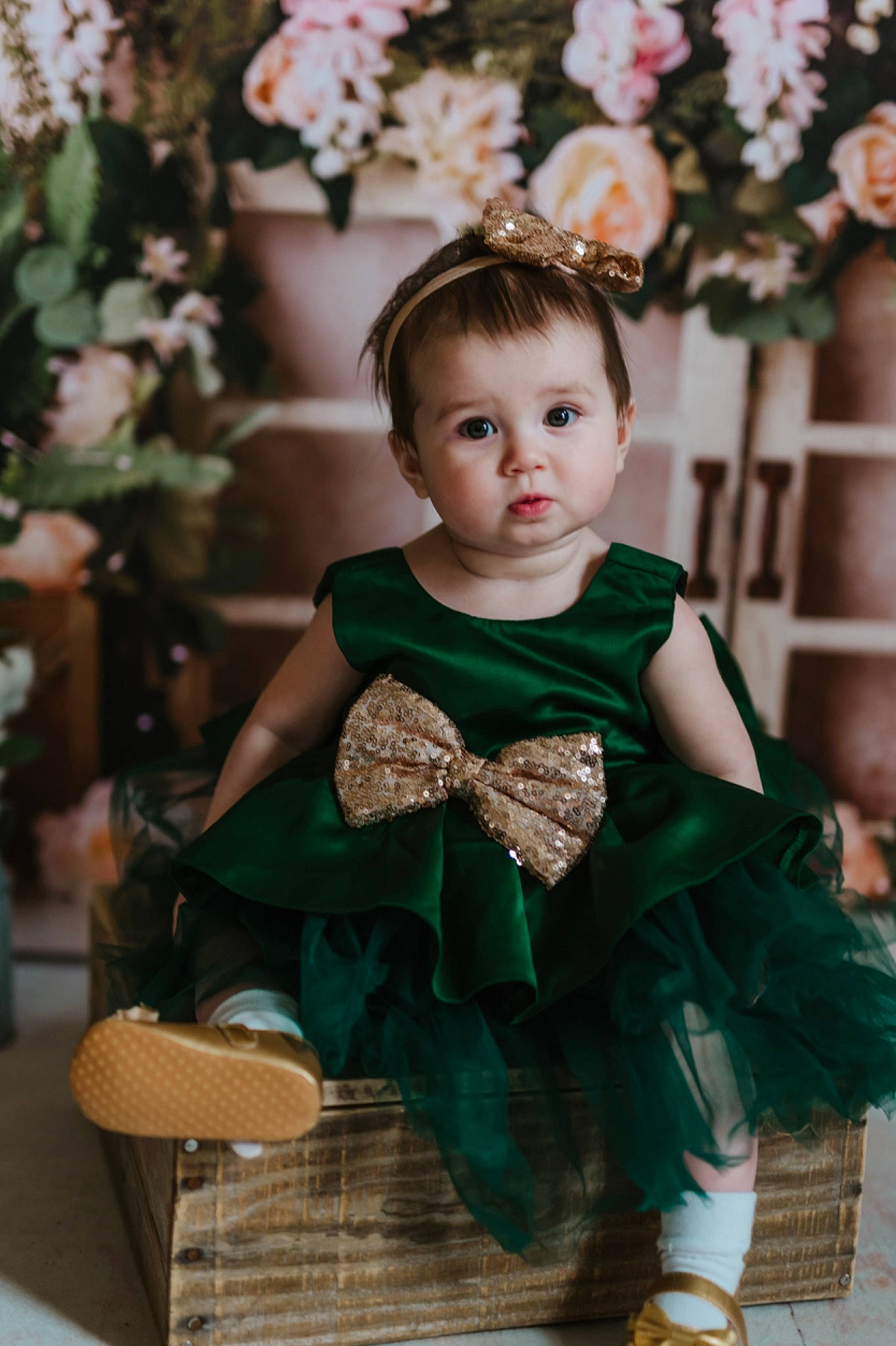 Alita joined the competition — help win amazing prizes! baby, baby_toddler_clothing, dress, eye, face, facial_expression, flash_photography, hair, happy, head, human_body, iris, outerwear, person, plant, skin, sleeve, standing, toddler, white
