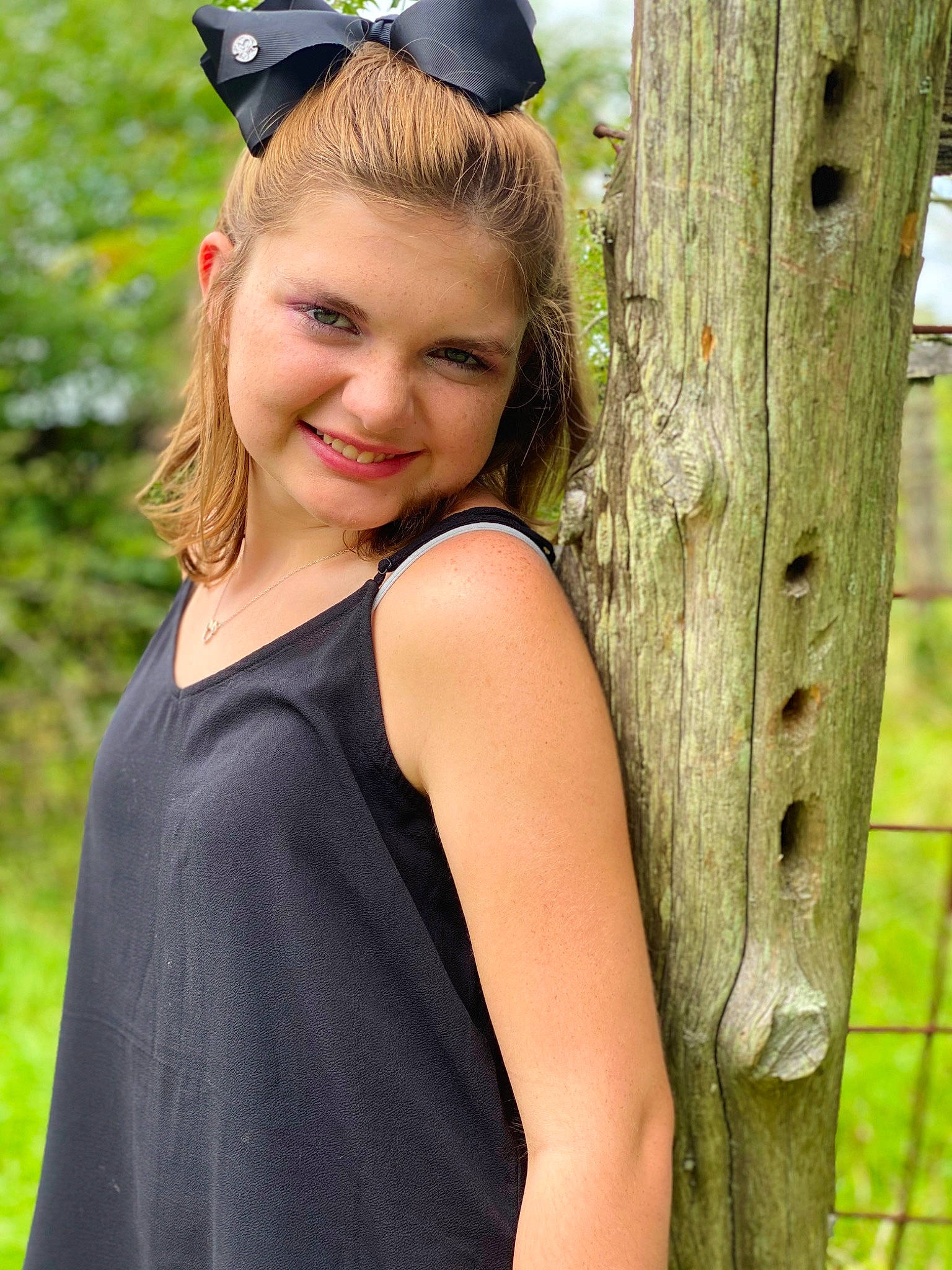 Kenzie is registered to the contest to win money with this photo: beauty, blond, brown_hair, child, child_model, clothing, dress, hair, hair_accessory, hairstyle, headband, headgear, joy, long_hair, person, photo_shoot, photography, shoulder, smile, tree