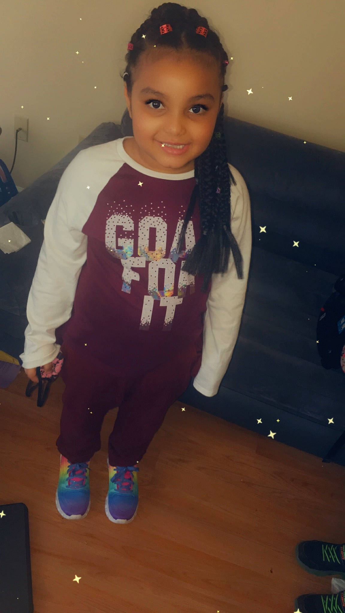 Jayliana is registered to the contest to win money with this photo: baby_toddler_clothing, black_hair, child, cool, electric_blue, fashion_design, flooring, fun, hairstyle, jersey, joy, long_sleeved_t_shirt, person, personal_protective_equipment, sleeve, sportswear, street_fashion, sunglasses, t_shirt, toddler