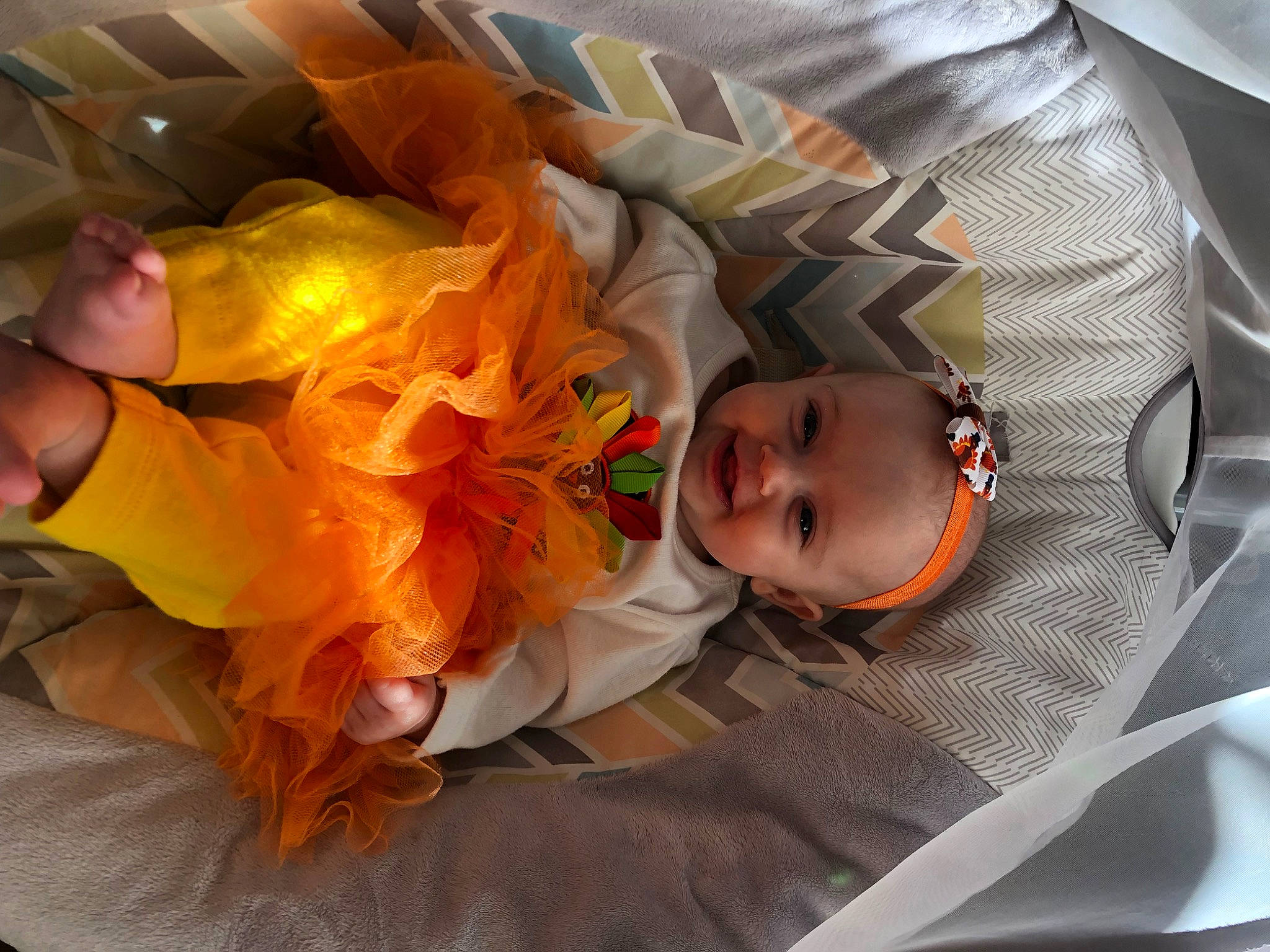 April joined the competition — help win amazing prizes! baby, baby_products, baby_toddler_clothing, child, comfort, event, fun, linens, orange, peach, person, product, room, textile, toddler