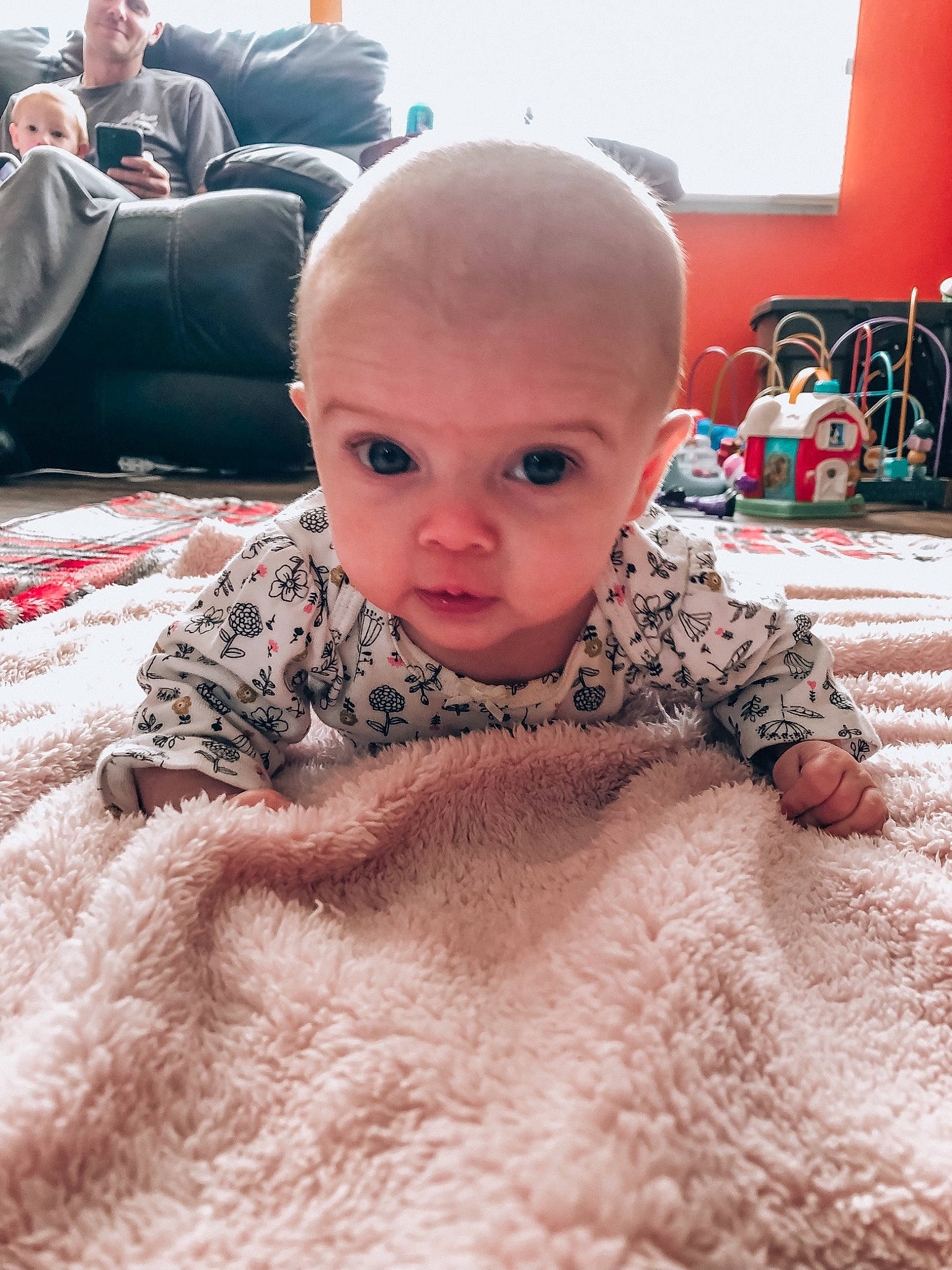 April joined the competition — help win amazing prizes! baby, carpet, cheek, child, chin, comfort, eyebrow, flooring, fun, fur, joy, linens, pattern, person, room, sand, sitting, skin, sleeve, smile