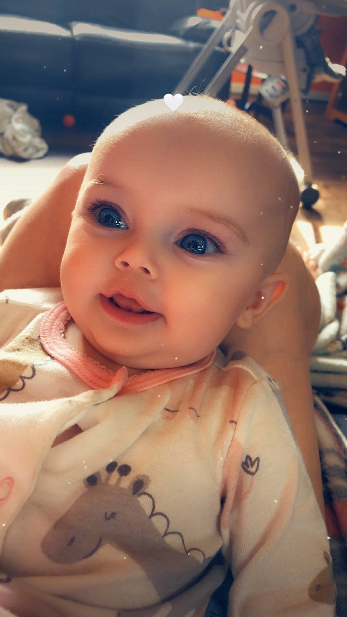 April is registered to the contest to win money with this photo: baby, cheek, chest, chin, ear, eyebrow, eyelash, face, forehead, hairstyle, hand, human_body, iris, lip, mouth, neck, nose, person, shoulder, skin