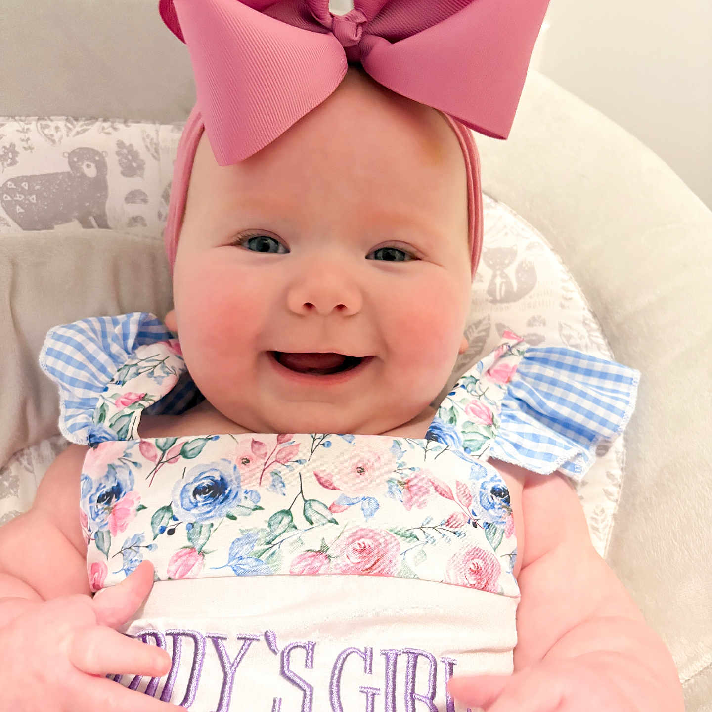 Sinclair joined the competition — help win amazing prizes! baby, baby_clothes, baby_girl, cheerful, child, close_up, cushioned_chair, cute, daddys_girl, floral_dress, happy, headband, indoors, infant, person, pink_bow, plush, portrait, seated, smiling