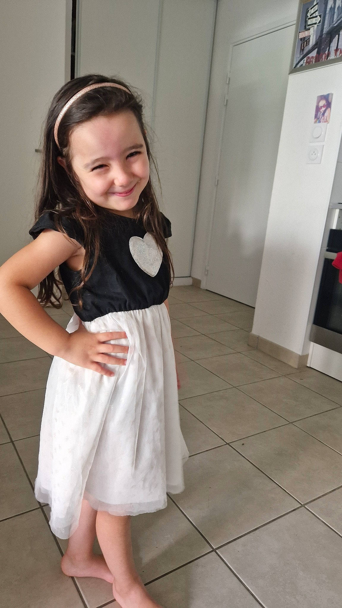 Lena a rejoint le concours — aidez-le/la à gagner de superbes lots ! baby_toddler_clothing, day_dress, dress, fashion_design, flash_photography, floor, flooring, hair, happy, joy, knee, leg, long_hair, neck, one_piece_garment, person, skin, sleeve, smile, standing